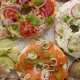 Bagel Sandwiches with Various Toppings Salmon Cottage Cheese Hummus Ham Radish and Fresh Herbs - VideoHive Item for Sale
