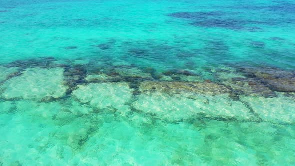 Tropical birds eye clean view of a paradise sunny white sand beach and turquoise sea background in 4