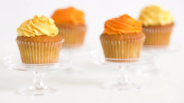 Cupcakes with Frosting on Confectionery Stands