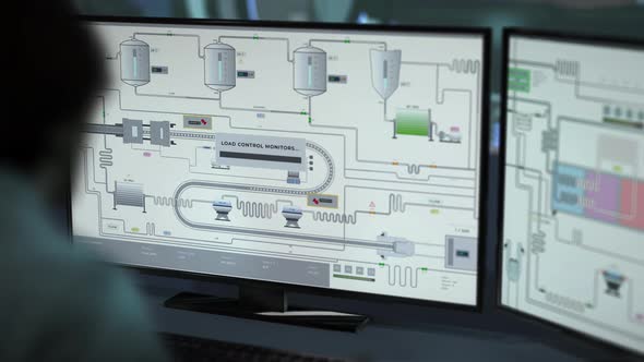 An engineer using modern software to monitor the production line at the plant alt