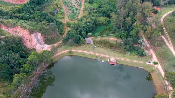 Aerial View of Valley with Lake, Forest and Villa in Tropical Country