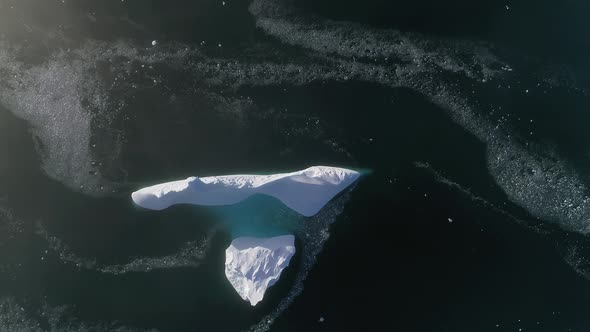 Top Down View Antarctic Iceberg. Aerial Flight