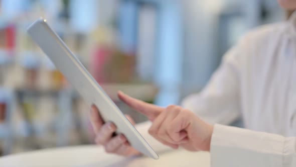 Close Up Woman Typing on Tablet Kept on Table