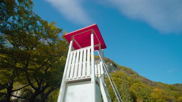 Rescue Booth Near Lamar Lake and Forest Under Blue Sky