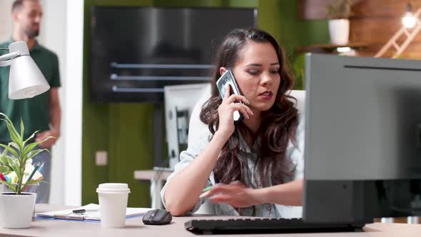 Revealing Shot of Businesswoman Talking on the Phone