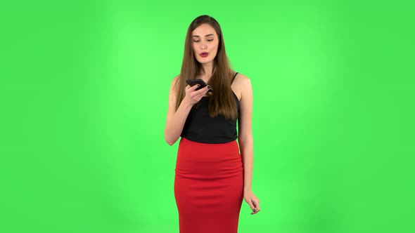 Girl Asks for Information on the Network Via Phone on Green Screen