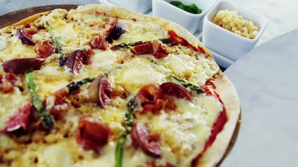 Baked pizza with fig toppings