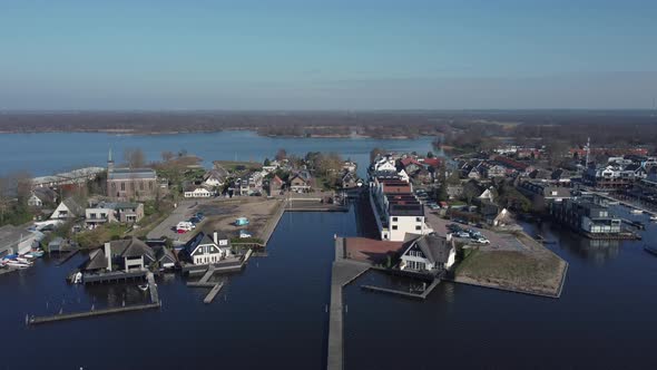 Loosdrecht dike in the Netherlands between the lakes, aerial downwards to pier