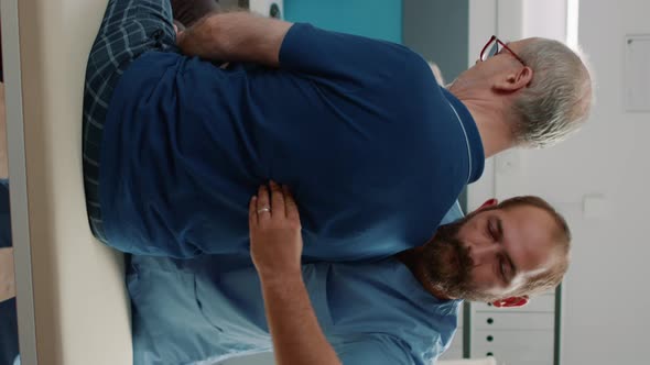 Vertical Video Physiotherapist Using Bones Cracking Procedure on Elder Patient