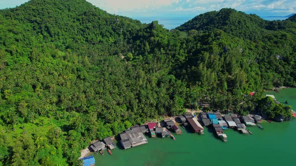 Aerial shot of local fisherman village beside the sea