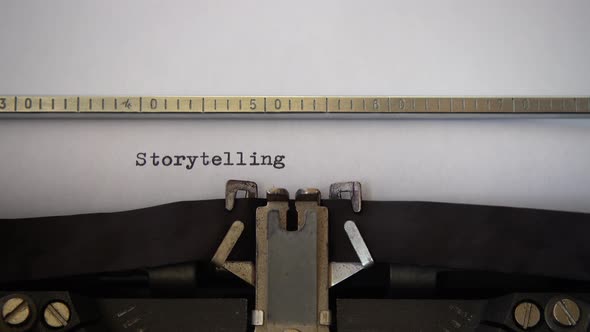 Typing word Storytelling on retro typewriter. Close up.