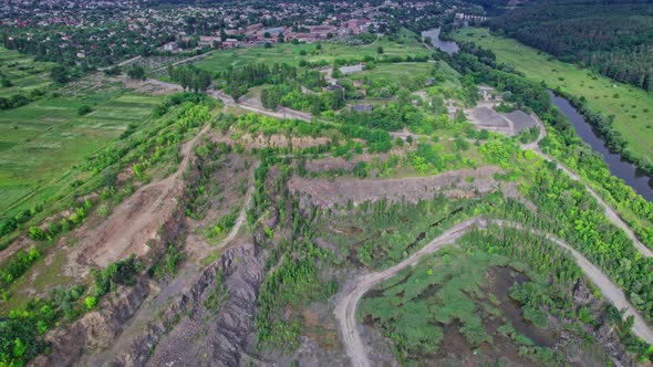 Dumpers and Machines are Working in the Quarry Mine