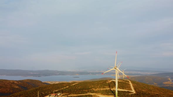 Drone Flies Over a Windmill Park