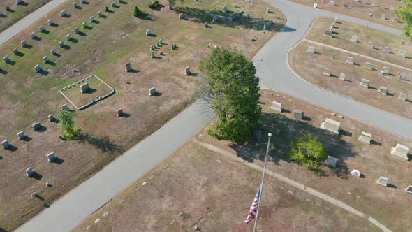 Aerial Drone Shot Orbiting a US Flag in Mt Feake Cemetery in Waltham Mass