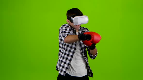 Man Plays in a Box with Vr Glasses. Green Screen