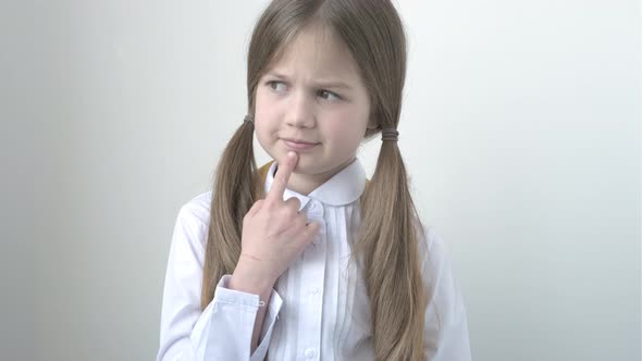 Schoolgirl Was Thoughtful Then Raised Index Finger Up with Great New Idea