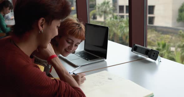 Young students studying inside university library