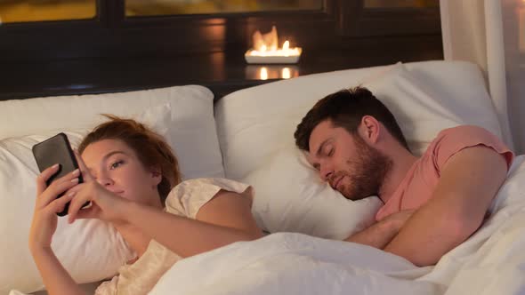 Woman Using Smartphone While Boyfriend Is Sleeping 31