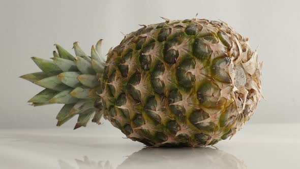 Slow tilt on  Ananas comosus exotic fruit  4K 2160p 30fps UltraHD  footage - Fresh  pineapple  laid 