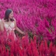 attractive asian female walking  along in beautiful flowers nature farm - VideoHive Item for Sale