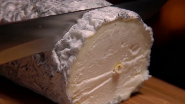 Cheese with Gray Mold Is Cut Knife on a Board