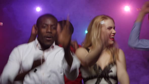 People of Different Nationalities Dancing at Party. Close-up Shift Camera