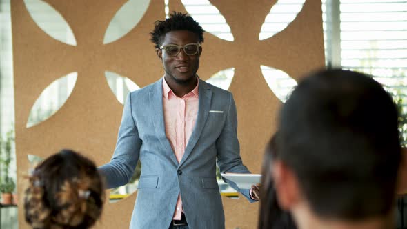 Confident African American Man Talking During Presentation