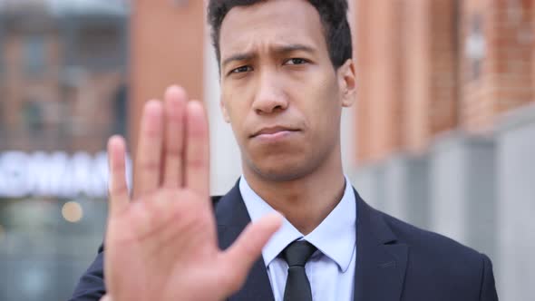 Gesture of Stop by African Businessman