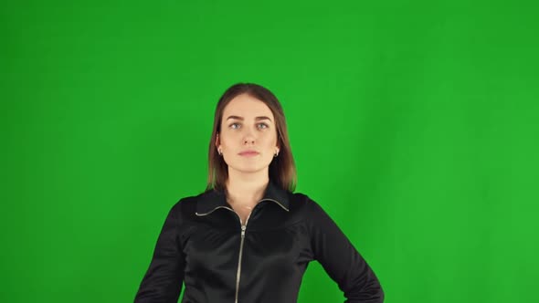 Woman Presses Virtual Buttons on a Green Screen