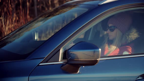 Woman Driving On Automobile. Hand On Car Steering Wheels. Driver Riding On Trip Holiday Vacation.