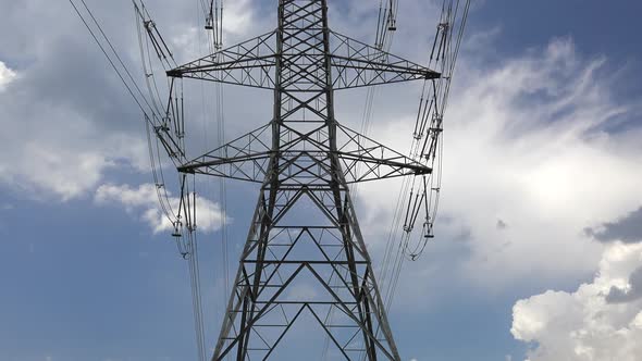 Looking at the Transmission Overhead Power Tower Line Towards the Sky