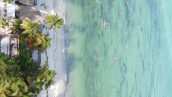 Vertical Video Boats in the Ocean Near the Coast of Zanzibar Tanzania Aerial View