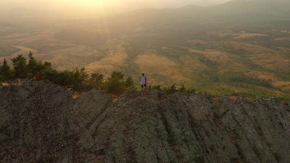 Hiker on back of a mountain, Puerto de la Puebla, Spain