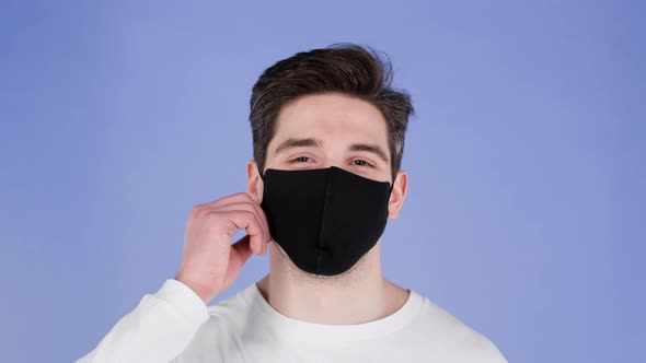 Pleased Man Removed Protective Facial Black Mask As Symbol of Pandemic Epidemic End