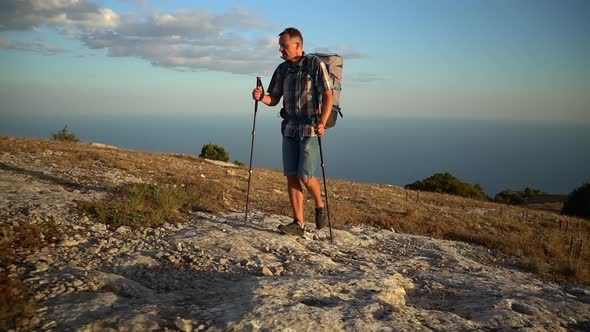 Young Male Hiker Climbing Mountain Against Backdrop of Amazing Natural Landscape Spbd alt