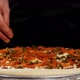 The Hand is Sprinkling the Pickled Paprika on the Pizza Closeup in Slow Motion - VideoHive Item for Sale