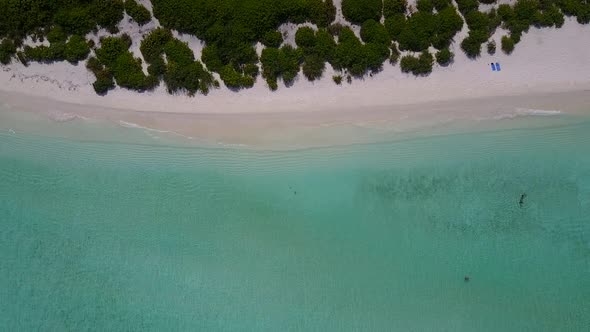 Sunny abstract of island beach by blue sea and sand background near reef