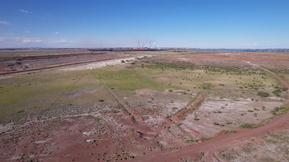 Drone View of a Wide Steppe and a Smoking Factory