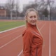 Portrait of woman in sportswear doing jogging at the stadium - VideoHive Item for Sale