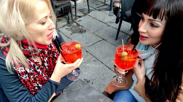 Girls Toasting Cocktails with Surgical Mask