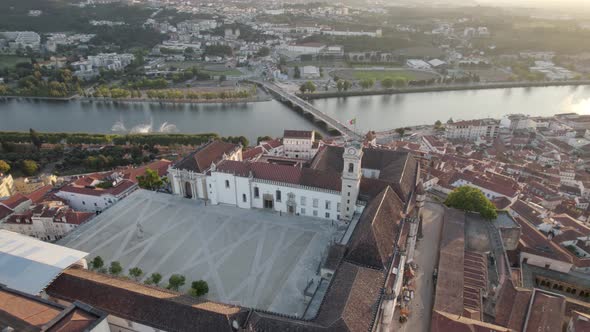 aerial top down view orbit over Coimbra university of law, Mondego river Backgound