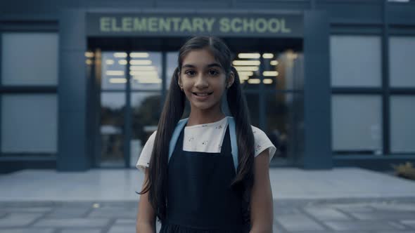 Indian School Girl Standing at Campus Entrance Closeup