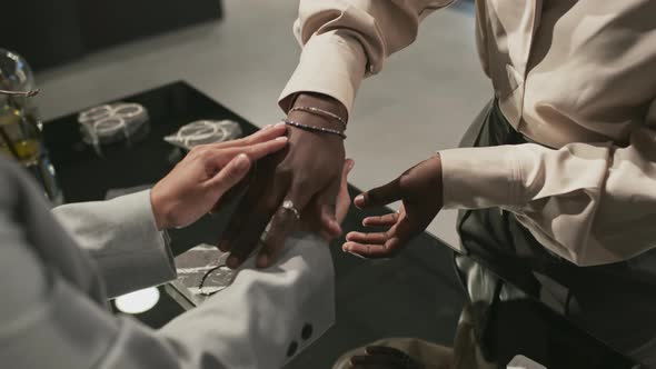 Salesperson Putting Bracelet on Woman