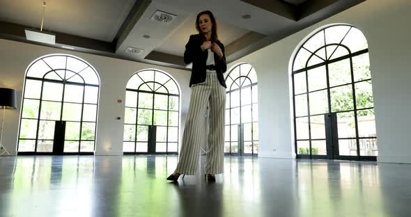 Woman Posing in front of Camera, Fashion Model Shoot. Low Angle Slider