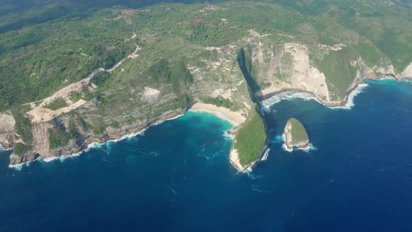 Aerial View of Green Island Washed By Blue Water of Ocean Nusa Penida Bali