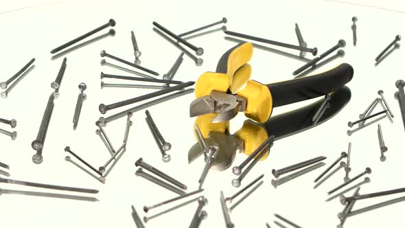 Mini Cutters with Yellow, Gray Handle on White Among Nails, Rotation, Reflection