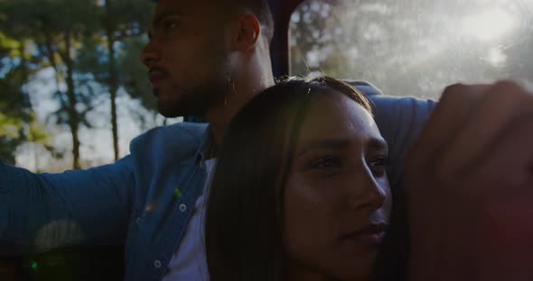 Young couple on a road trip in their pick-up truck