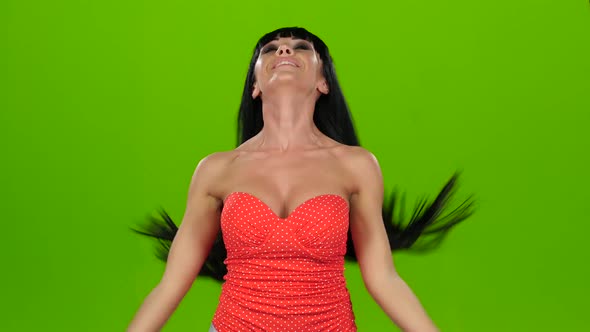 Brunette Girl in Red Corset Poses on Camera, Green Screen