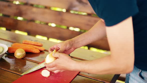 CU Travelling Shot Man is Standing in a Summer House Cooking Pilaf for Picnic