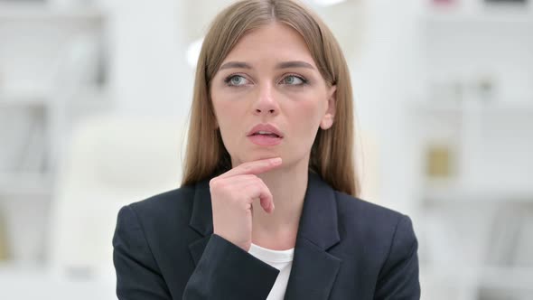 Portrait of Pensive Businesswoman Thinking About Something 